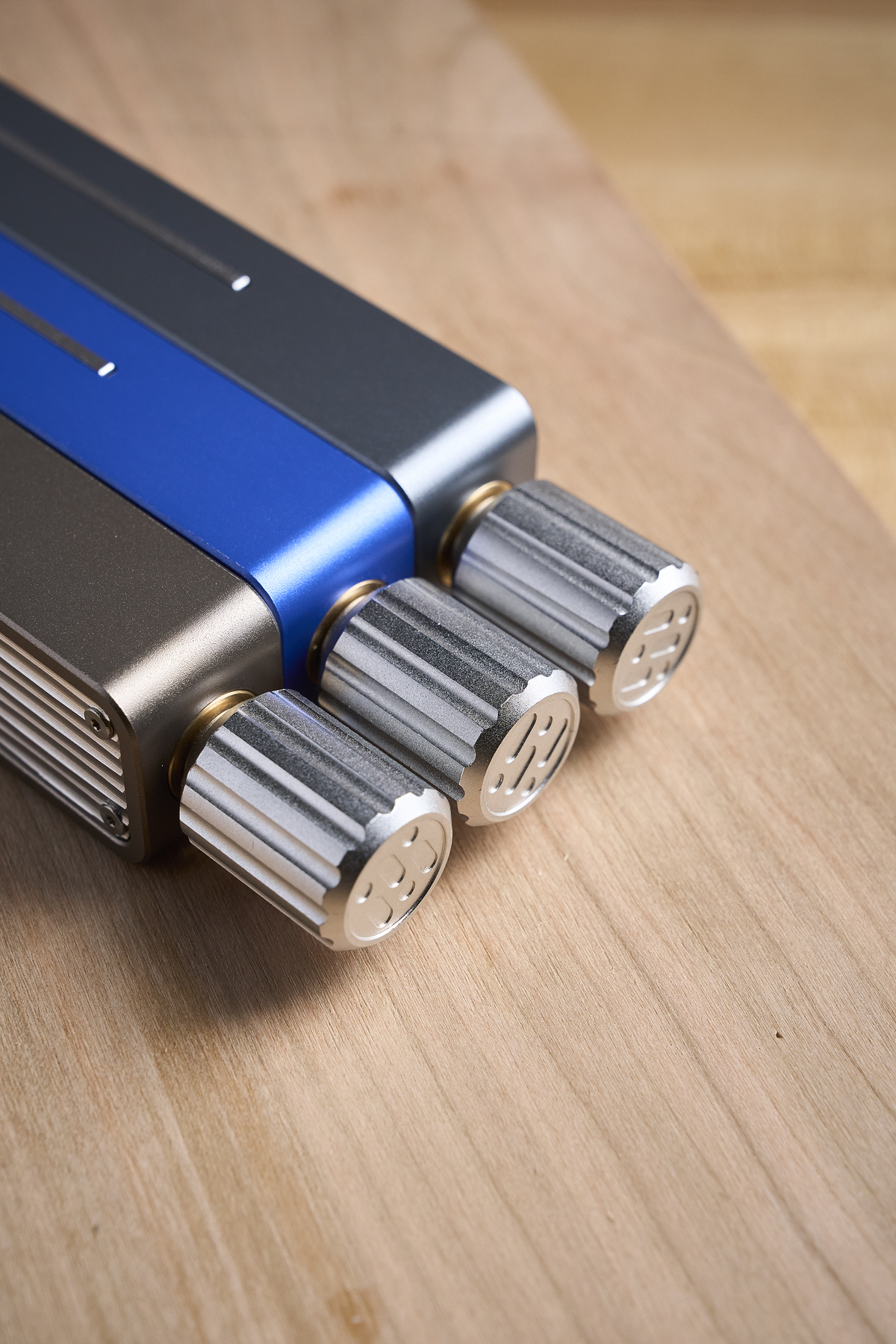 Sliding bevel gauge head with silver ridged bars and round adjustment knobs
