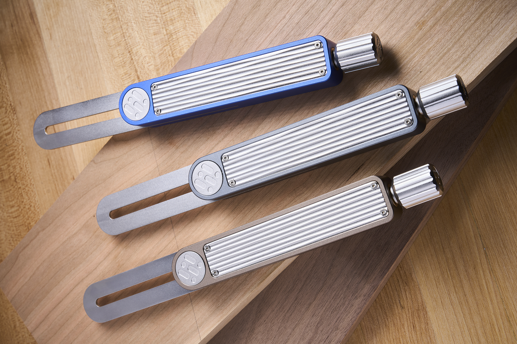 Three sliding bevel gauges in blue, silver, and gray with locking knobs