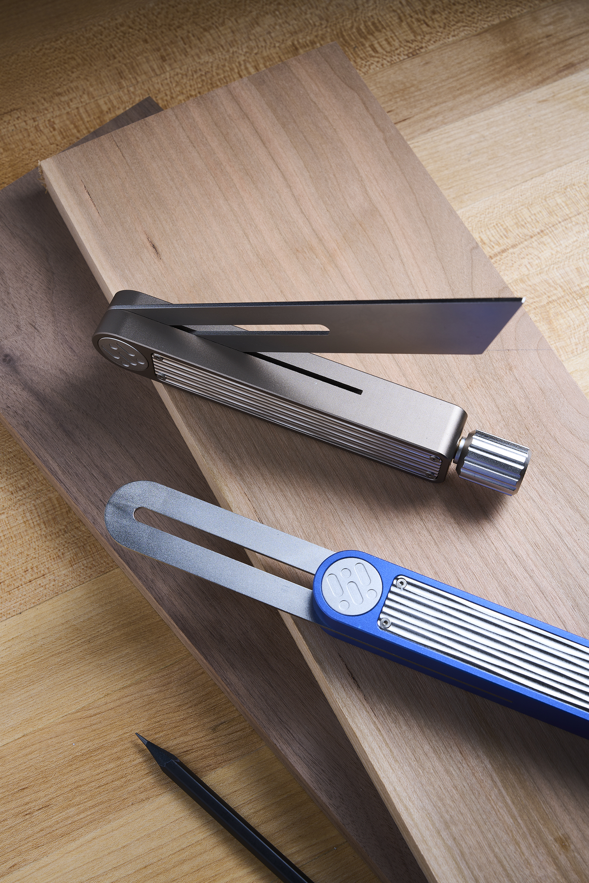 Sliding bevel gauge with adjustable blade and blue handle body